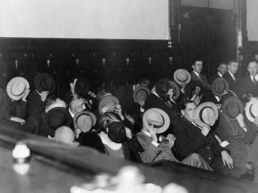 Mobsters hide their faces at Al Capone’s trial 1931.